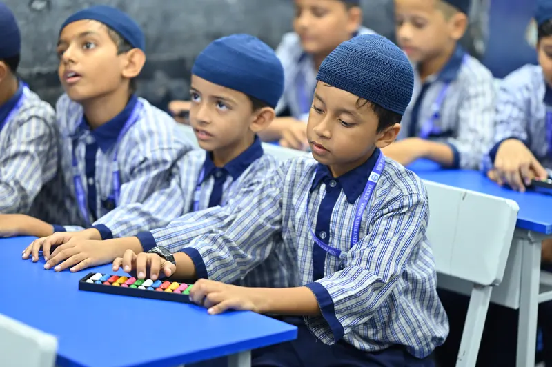 Students working with abacus frames during a mental mathematics class