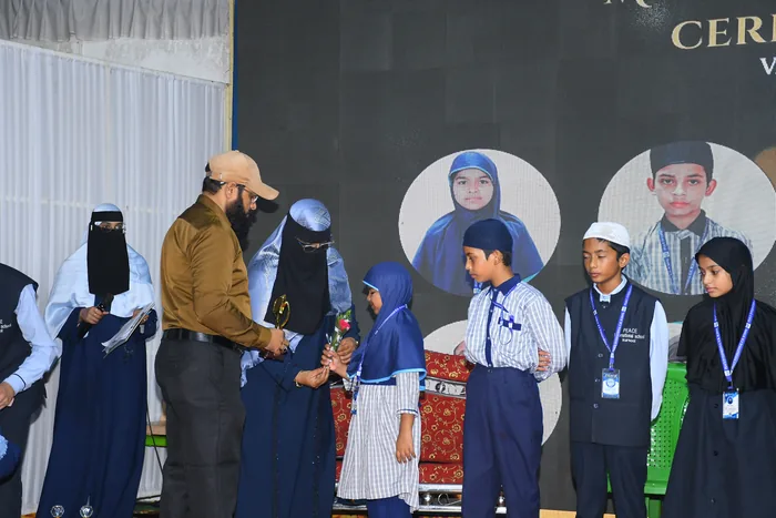 Students lined up on stage to receive their awards at the annual prize distribution