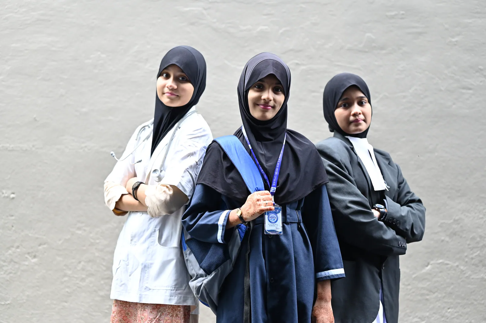 Students in professional dress representing medicine, law and engineering on career day