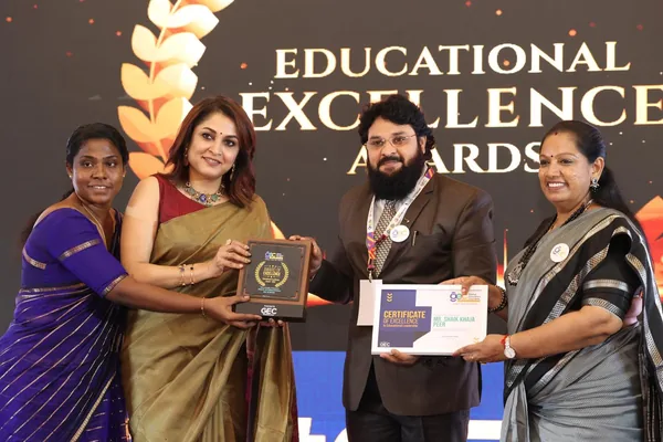 The school's Award of Excellence and Certificate of Excellence in Educational Leadership being presented on stage at the Educational Excellence Awards