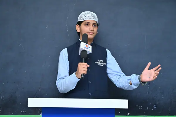 A student speaking from the podium at the Peace Talent Stage — Peace English Medium School, Kurnool