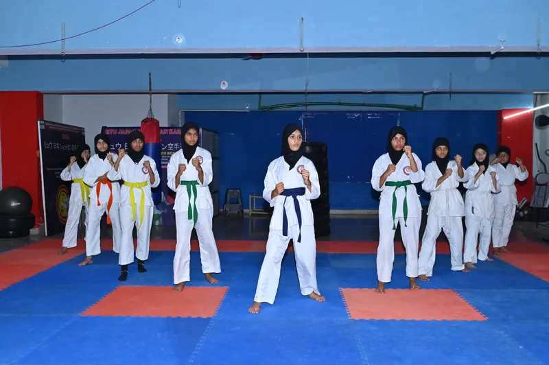 Students lined up in karate uniforms during a martial arts training session
