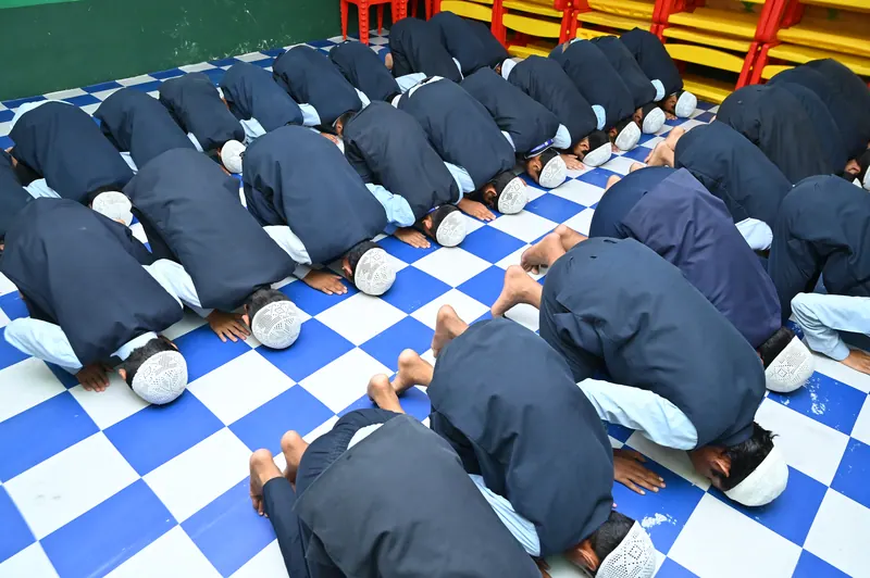 Students in an Islamic studies lesson at Peace English Medium School