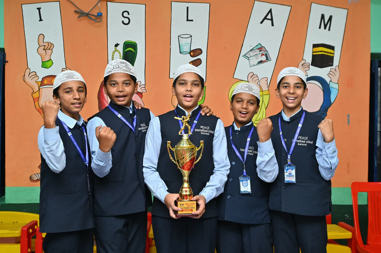 Students holding a trophy after winning an inter-class competition
