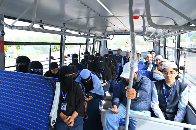 The interior of a Peace school bus with students seated