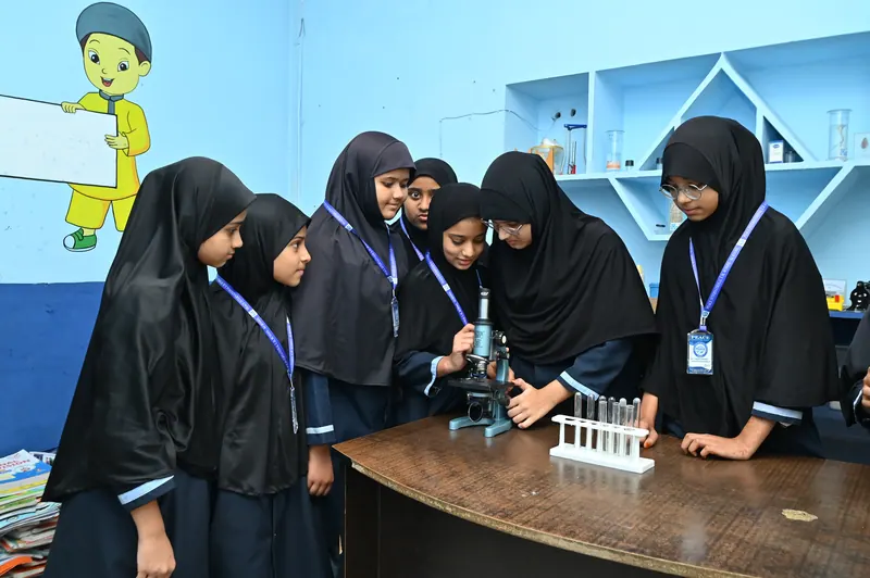 Middle school students conducting an experiment in the science laboratory