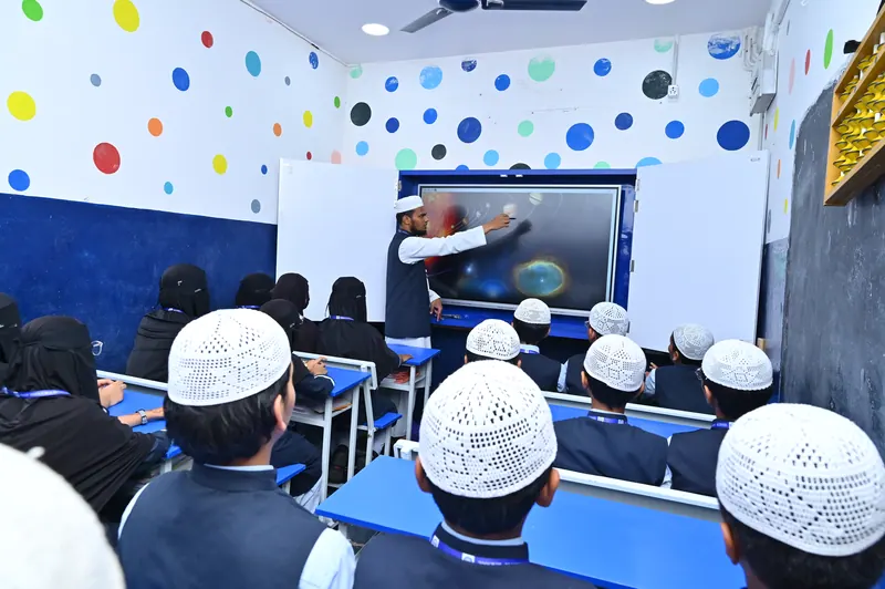 A teacher leading an interactive session at the digital panel