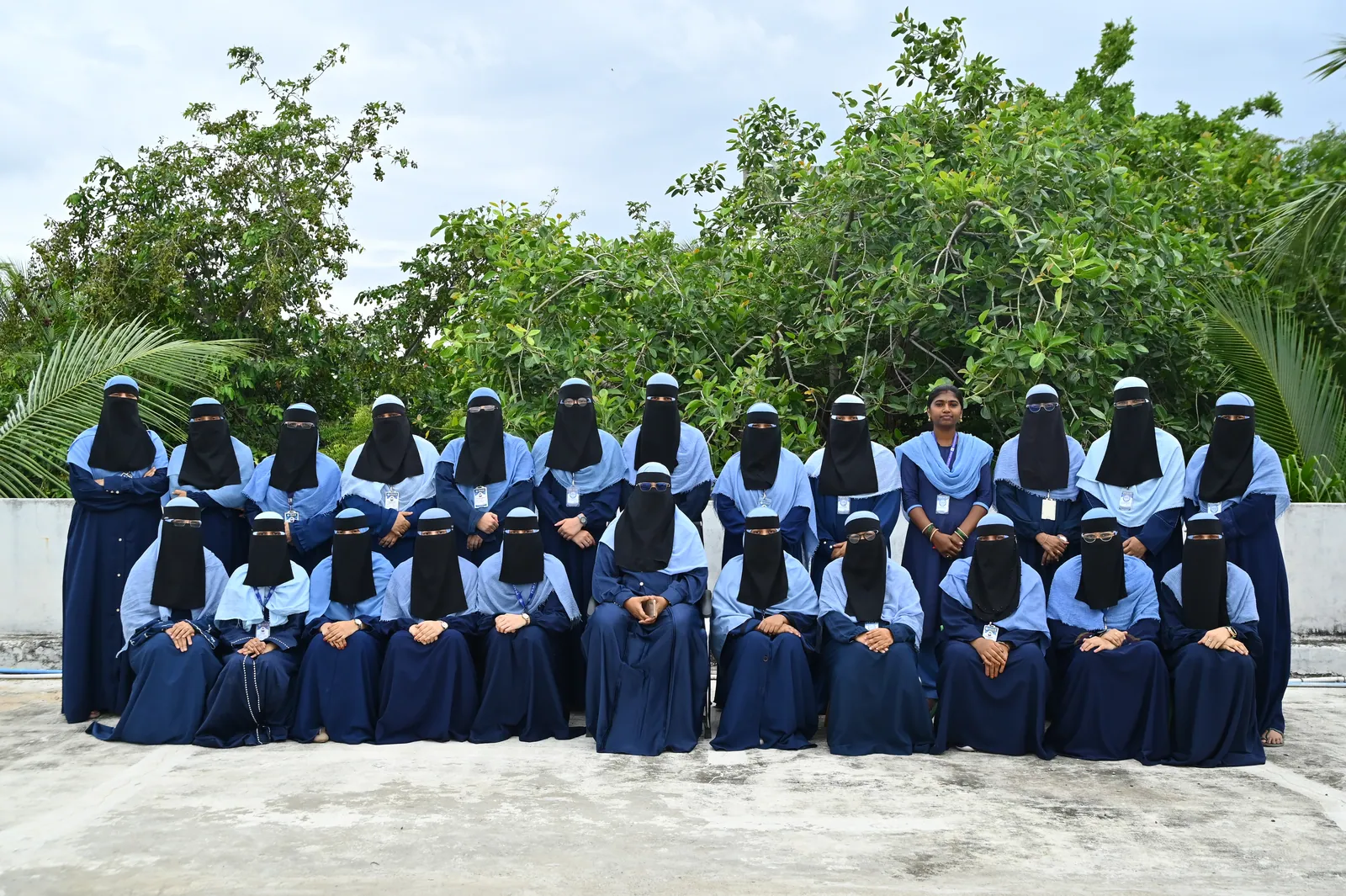 The teaching staff of Peace English Medium School gathered for a group photograph