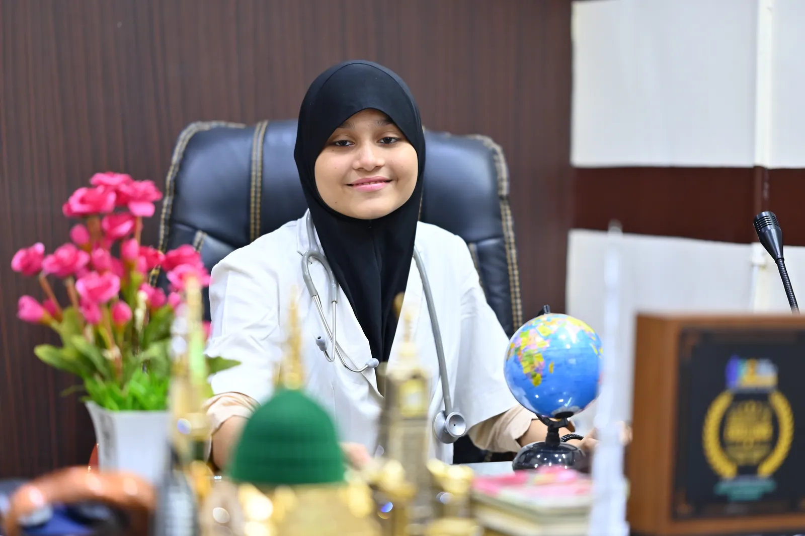 A student seated at a desk in a leadership role-play activity